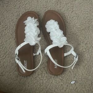 Tan sandals with white floral design